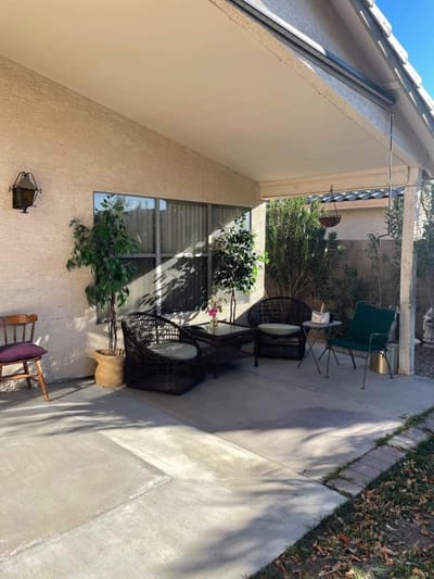 Outdoor seating area with plants and shade