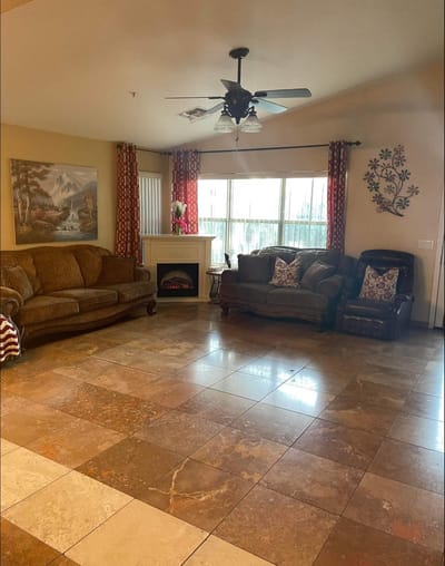Cozy common area with sofas and a fireplace