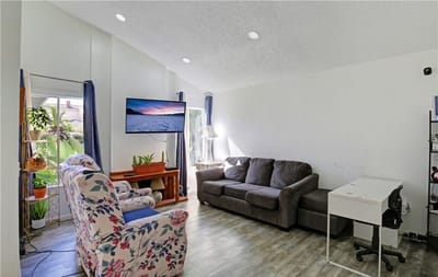 Bright common area with seating and plants