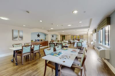 Bright dining area with tables and chairs