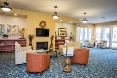 Bright common area with seating and fireplace