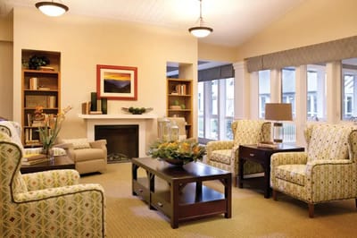 Bright common area with comfortable seating and a fireplace