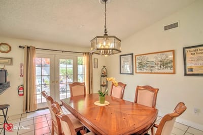 Dining area with a large wooden table and chairs