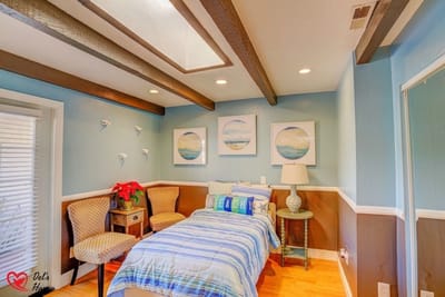 Cozy resident room with a bed and seating area