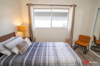 Cozy bedroom with a window and chair