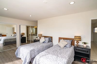 Well-appointed resident room with twin beds and decor