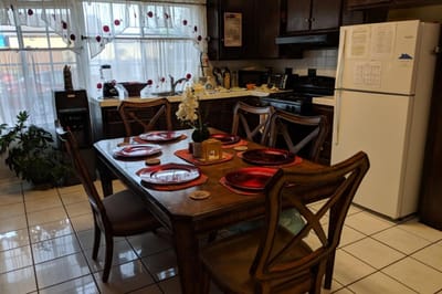 Cozy dining area with a set table for meals