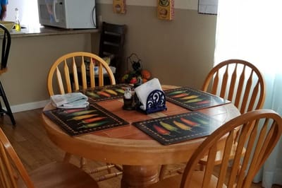 Dining area with a wooden table and chairs