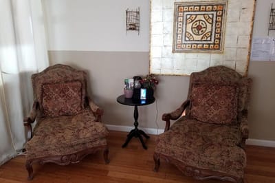 Cozy sitting area with two antique chairs