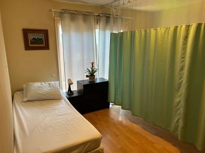 Private resident room with bed and greenery