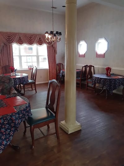 Bright dining room with decorated tables and chairs