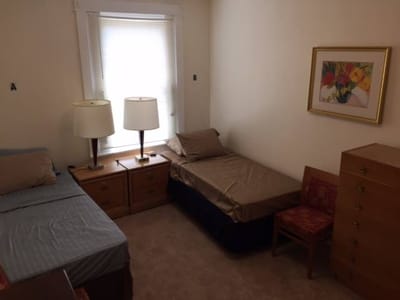 Cozy shared resident room with lamps and beds