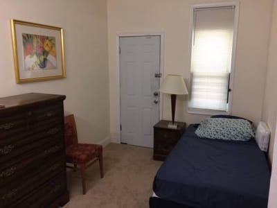 Cozy resident room with bed and decorative elements