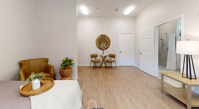 Cozy interior of a private resident room with seating