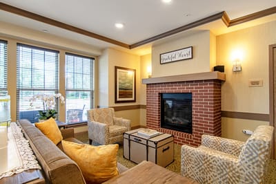 Interior view of a cozy common area with a fireplace