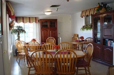Bright dining area with wooden tables and chairs