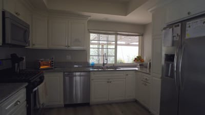 Modern kitchen with natural light and granite countertops