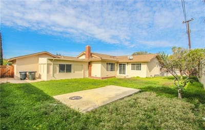 Outdoor view of a residential area with grass and house