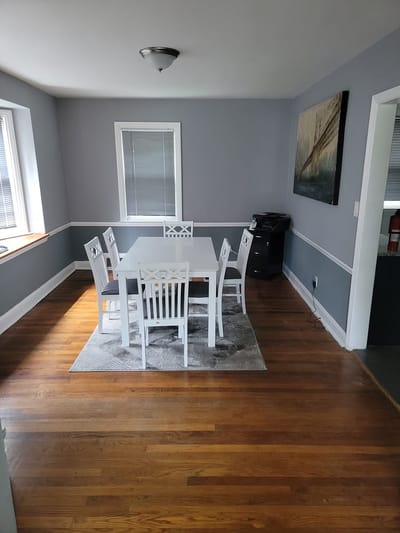 Bright dining area with white furniture