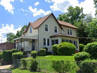 Front view of a residential building with landscaping