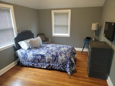 Cozy private resident room with wood flooring