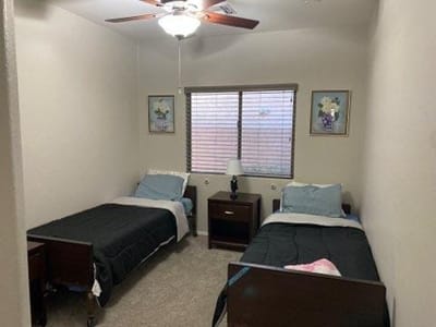 Private resident room with two beds and decor