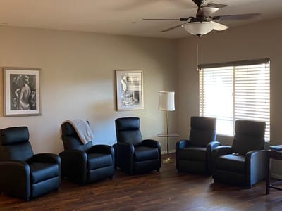 Interior lounge area with seating and artwork