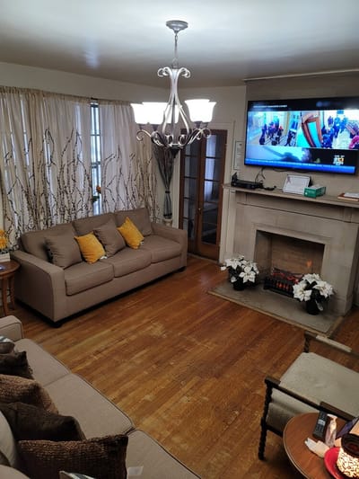Cozy common area with residents in a living room setting