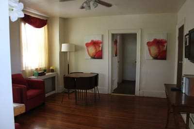 Bright living area with floral art and seating