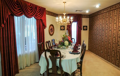 Elegant dining room set for a meal.