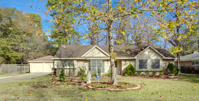 Exterior view of a senior living facility with gardens