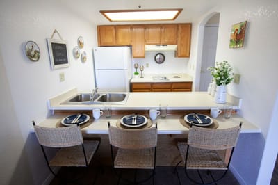 Bright interior kitchen area with dining setting