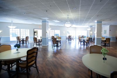 Spacious common area with tables and chairs