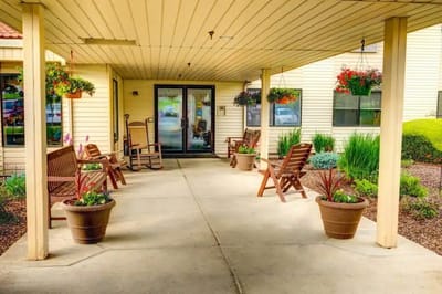 Covered outdoor seating area with flower pots