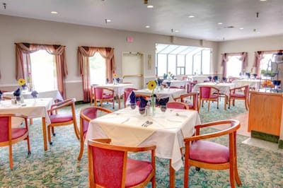 Dining room with tables set for a meal