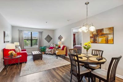 Bright interior common area with seating and dining space