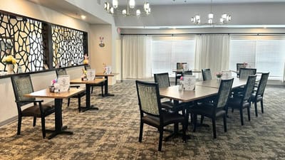Bright dining room with tables and floral decorations