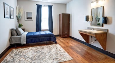 Spacious private room with wooden flooring and modern decor