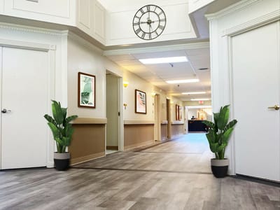 Hallway in a senior living facility with plants