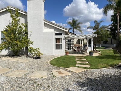 Outdoor space with seating area and garden path