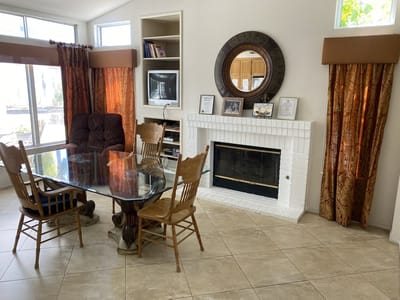Common area with chairs and a fireplace