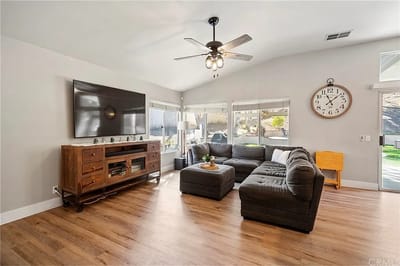Cozy common area with a large sectional sofa and a TV