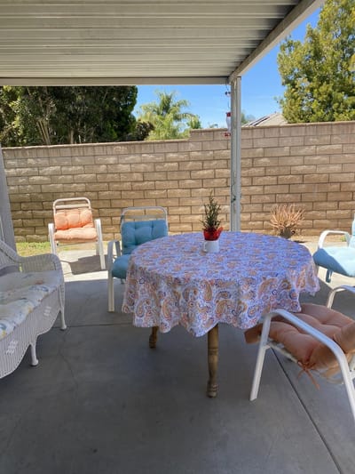 Outdoor seating area with a table and chairs