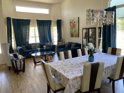 Bright common area with seating and dining table