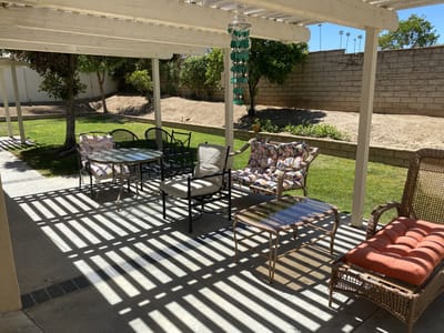 Outdoor seating area with shaded lounge chairs