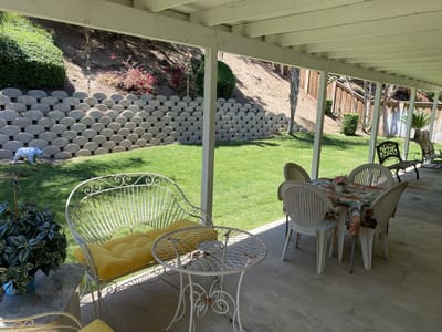 Outdoor patio area with tables and chairs