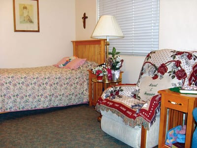 Cozy resident room with floral bedding and decor