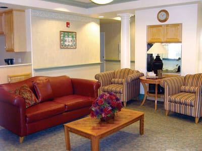 Common area with seating and decor in a nursing home