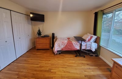 Private resident room with bed and furniture