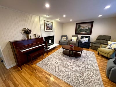 Interior common area with seating and a piano